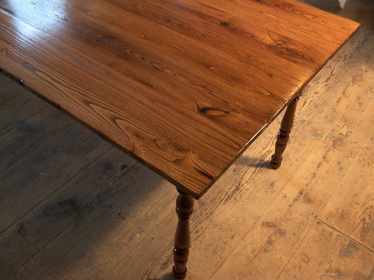 Antique farm table made of wormy chestnut