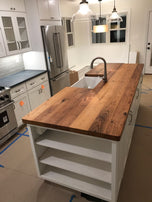 Butcher block countertop with massive wooden top in a luxury kitchen room