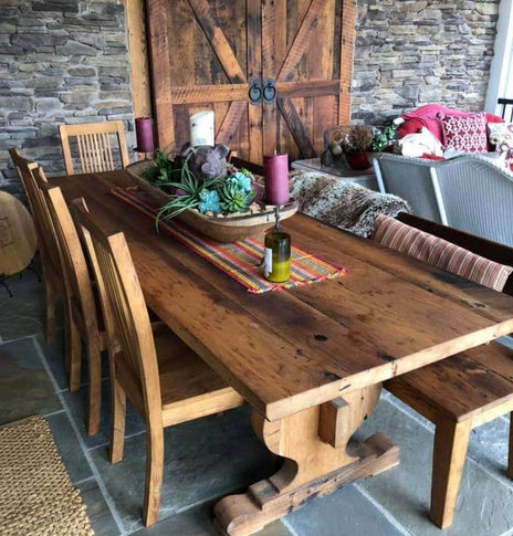 Trestle dining table made of reclaimed solid wood. Modern farmhouse wooden table with antique design