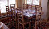 Dining chairs made of reclaimed wood close to a dining table