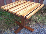 Kitchen table in the backyard made of colorful wood, square shaped